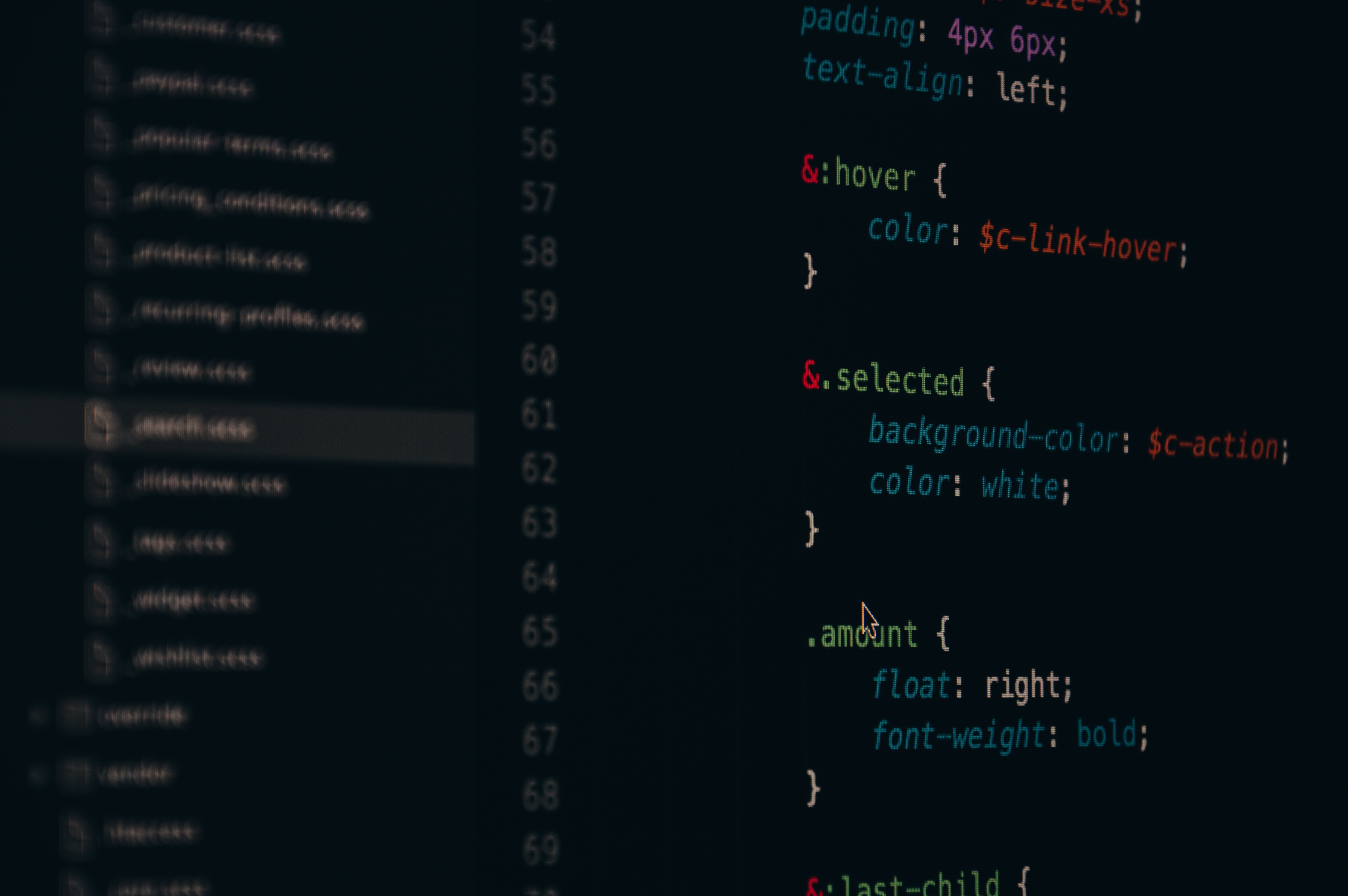 Close-up of SCSS code on a dark editor screen