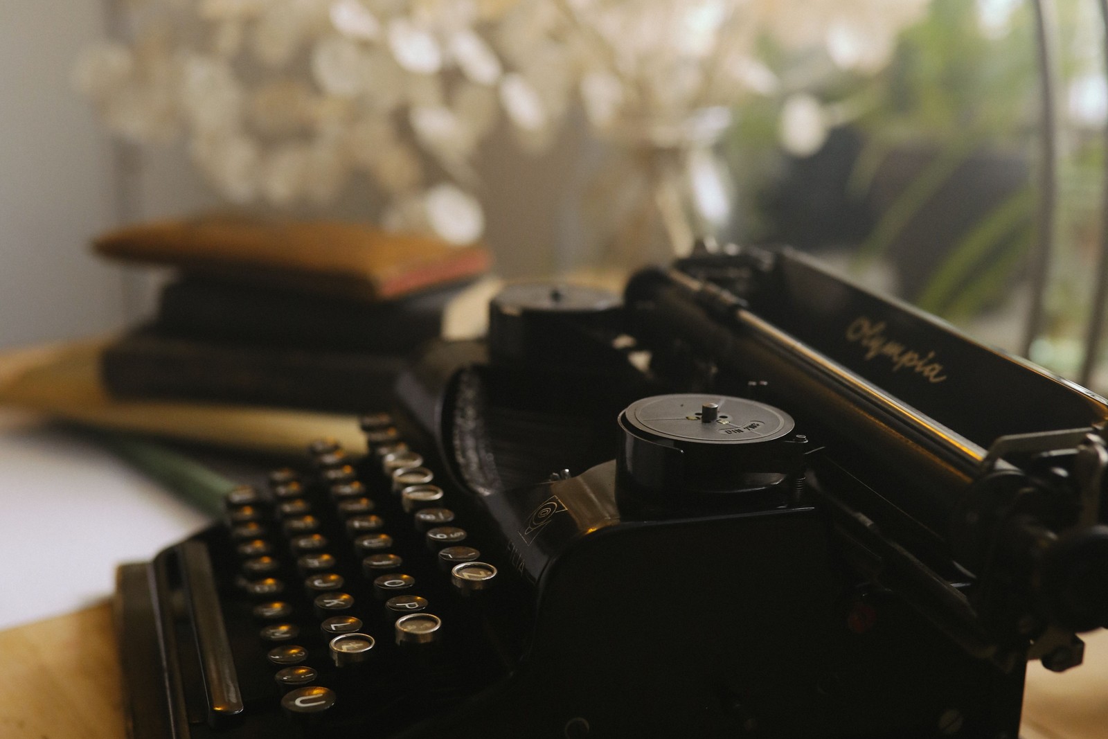 Close up of a vintage typewriter's keys and mechanism with warm lighting, evoking six decades of advertising history