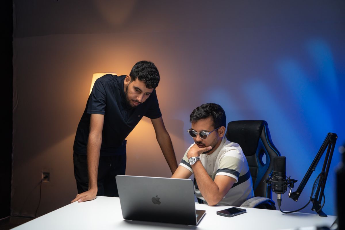 Two collaborators building the website together